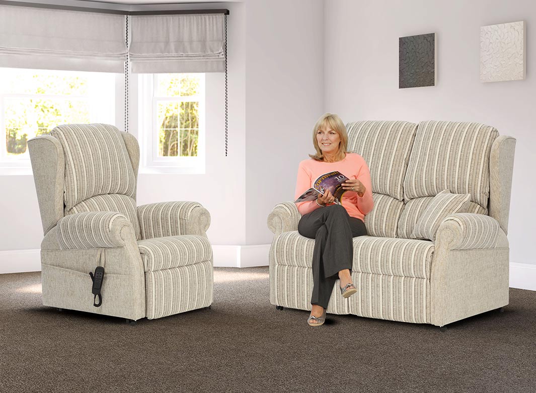 rise-and-recliner-chair-with-a-woman-sat-on-a-settee-next-to-it