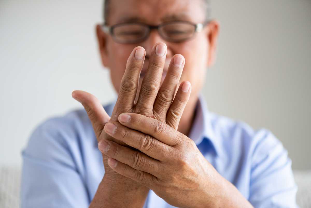 asian-man-suffering-arthritis-hands