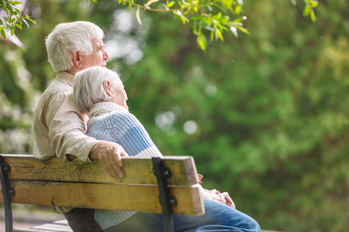 older-couple-sitting-on-bench